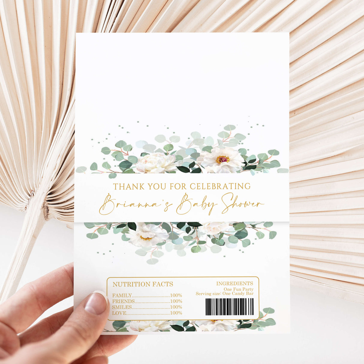 Printed chocolate wrapper with green greenery florals and thank-you baby shower text