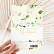 White chocolate bar wrapper with printed white roses, green greenery, and thank-you details